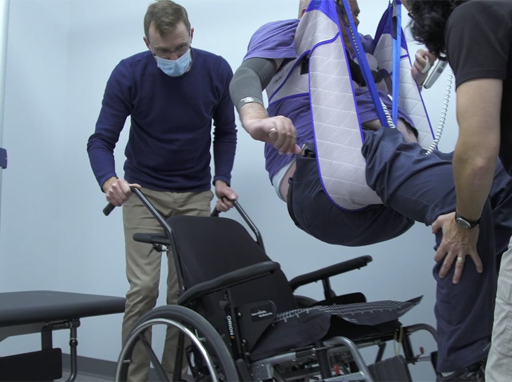 An Occupational Therapist fits a wheelchair user to a wheelchair using the ForeSite SS Wheelchair Seating system.