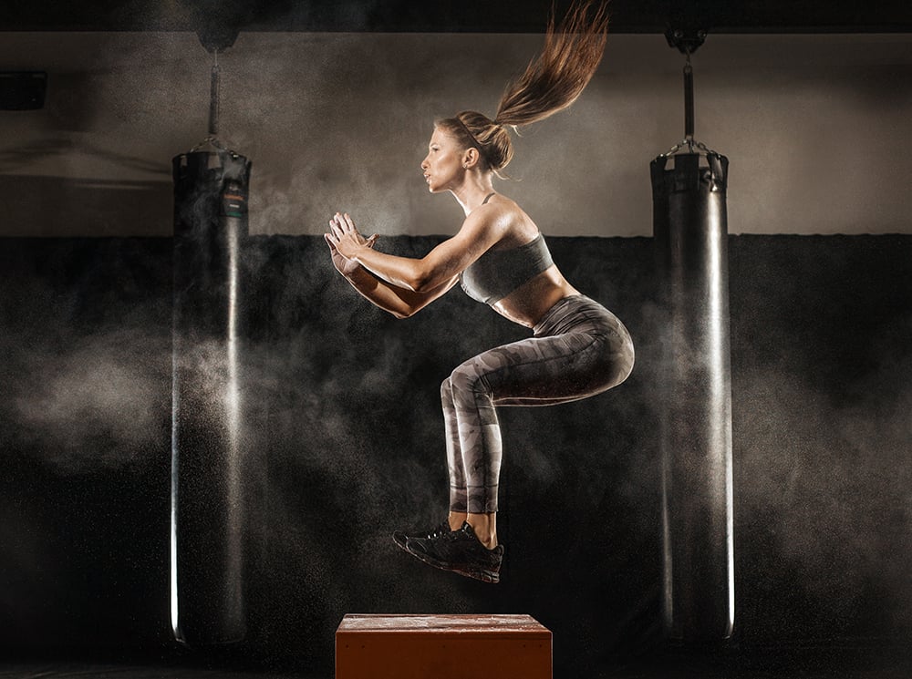 Athlete jumping onto a jump block.