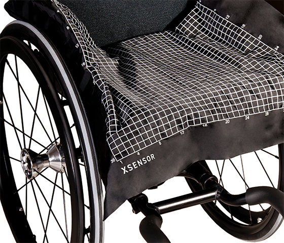 Wheelchair with XSENSOR's ForeSite SS Wheelchair Seating System sensor on the seat surface.