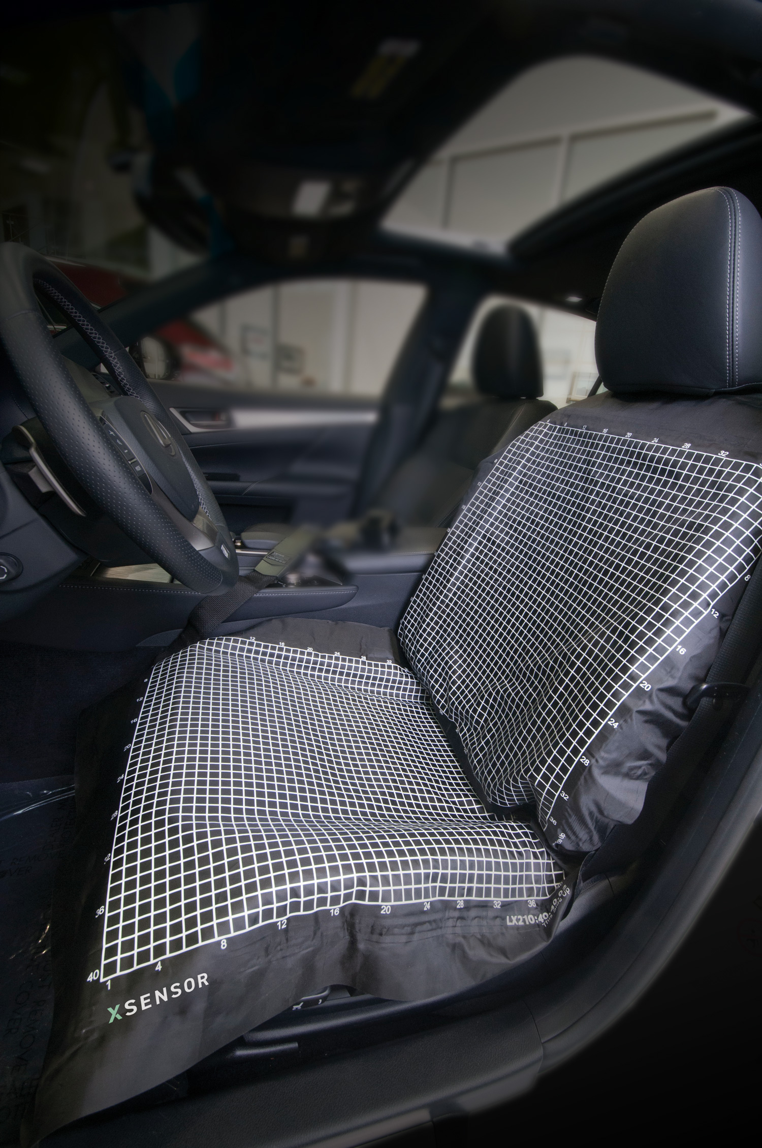 Vehicle seat with XSENSOR's pressure mapping sensor on the back and seat surface.