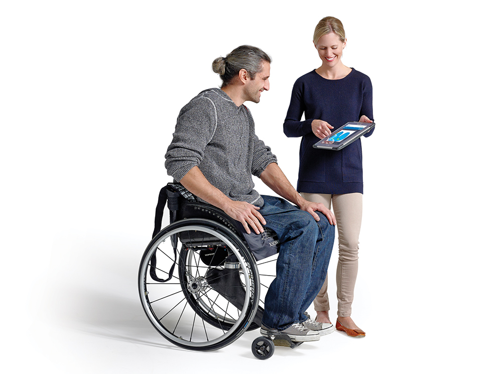 Physical Therapist and Wheelchair User using XSENSOR's ForeSite SS Wheelchair Seat System.